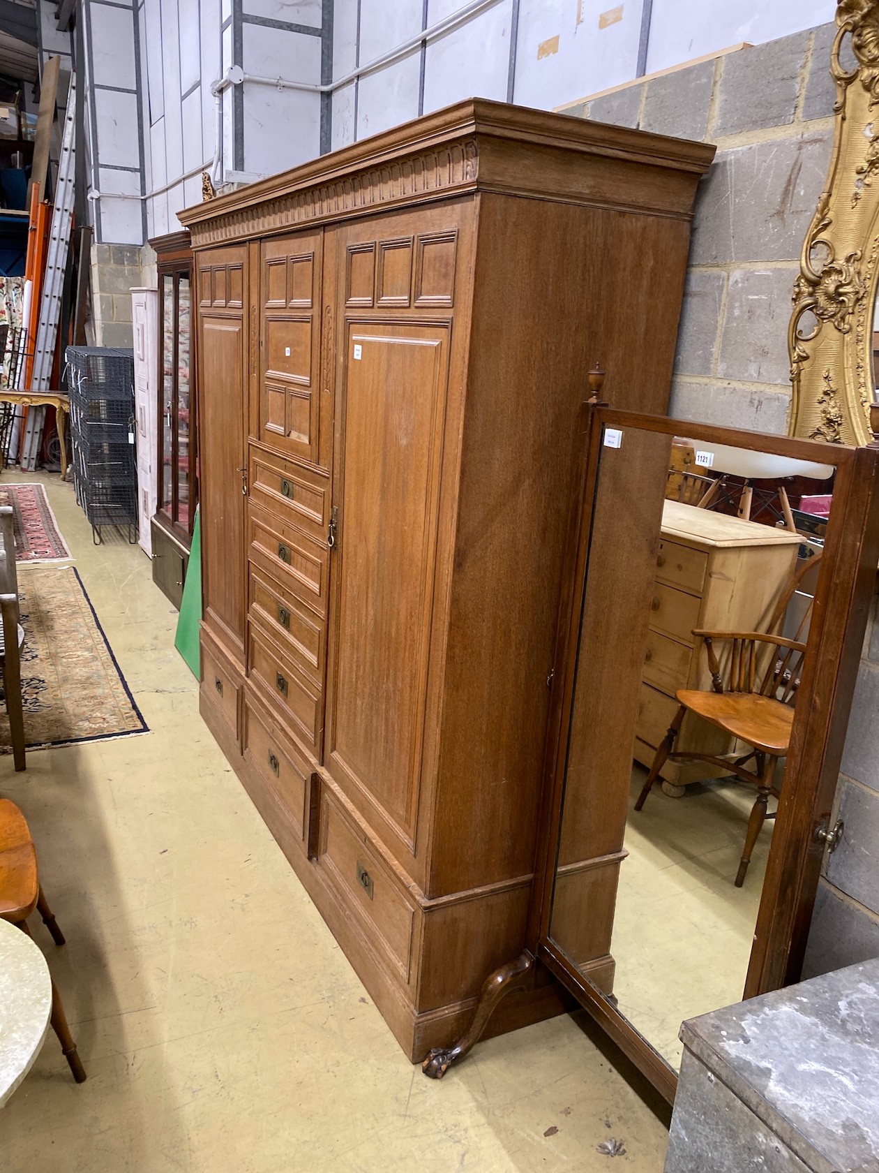 A late 19th century German Art Nouveau oak compactum wardrobe, length 224cm, depth 56cm, height 204cm